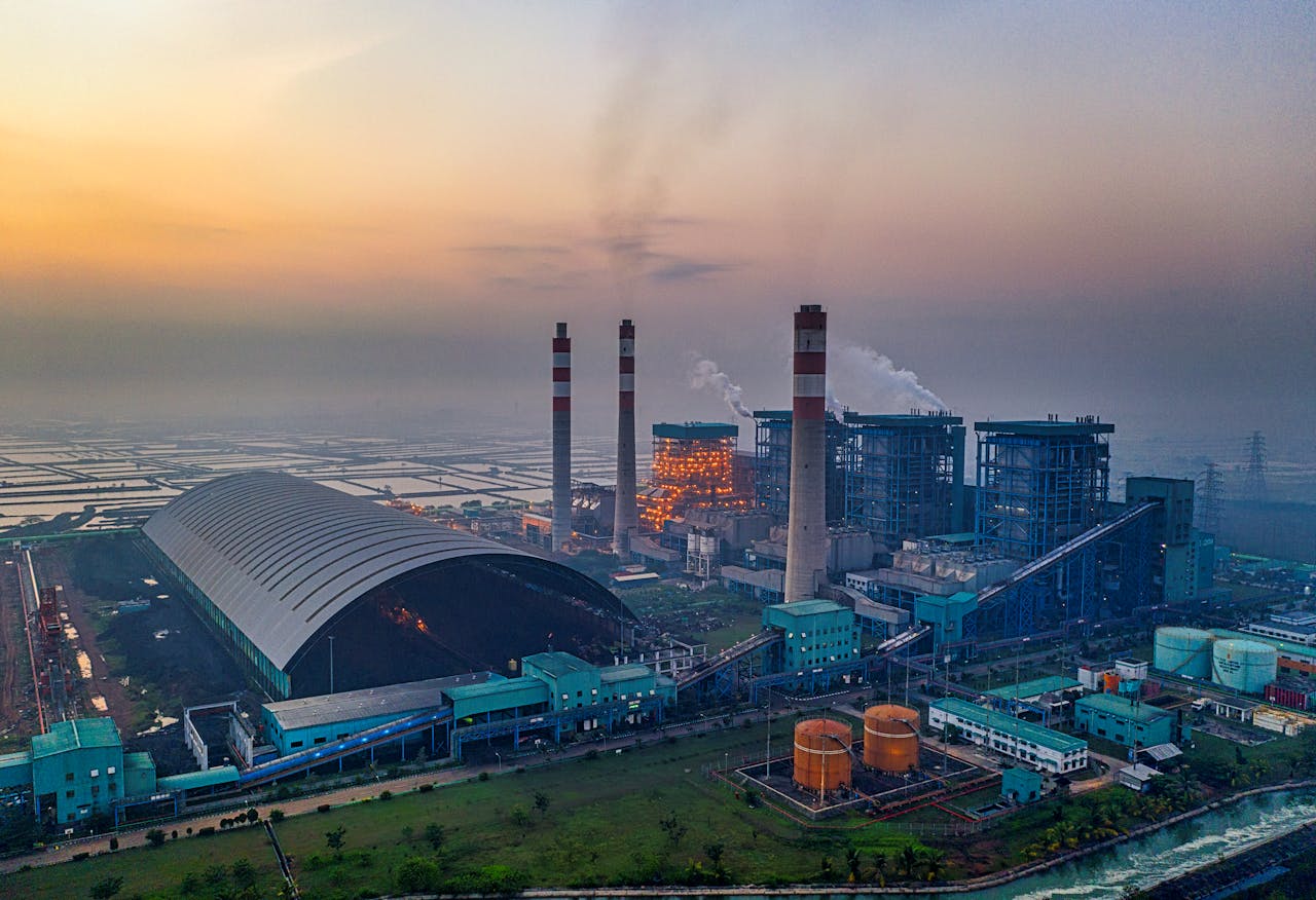services-01 Aerial view of a large industrial power plant in Banten, Indonesia at sunset.