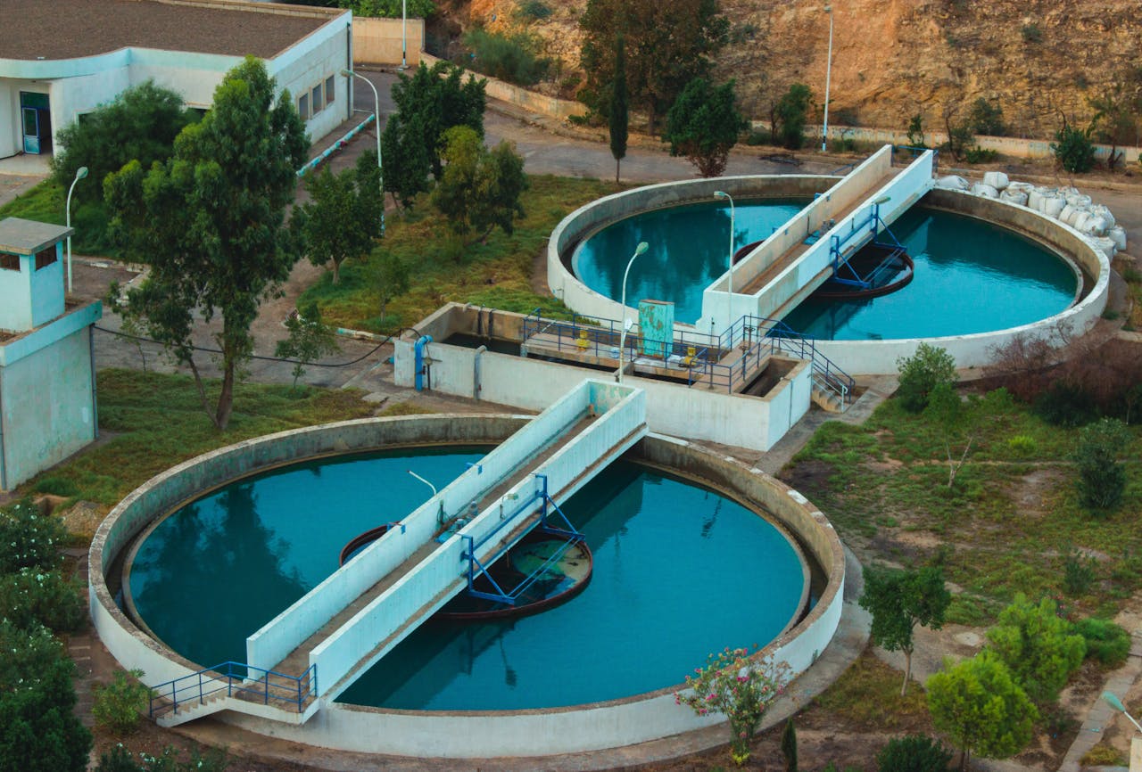 who-we-are Drone shot of an advanced water purification plant surrounded by trees.